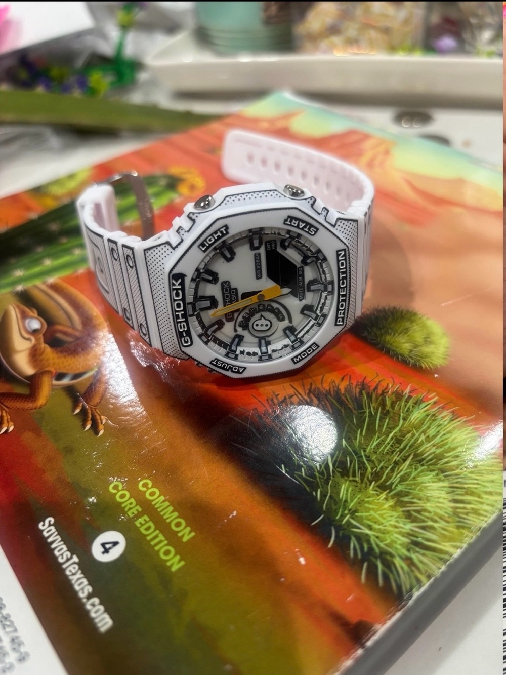 G-Shock White Resin Watch with Black Markings and Yellow Accent